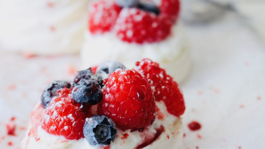 Meringue with whipped cream raspberry and blueberry