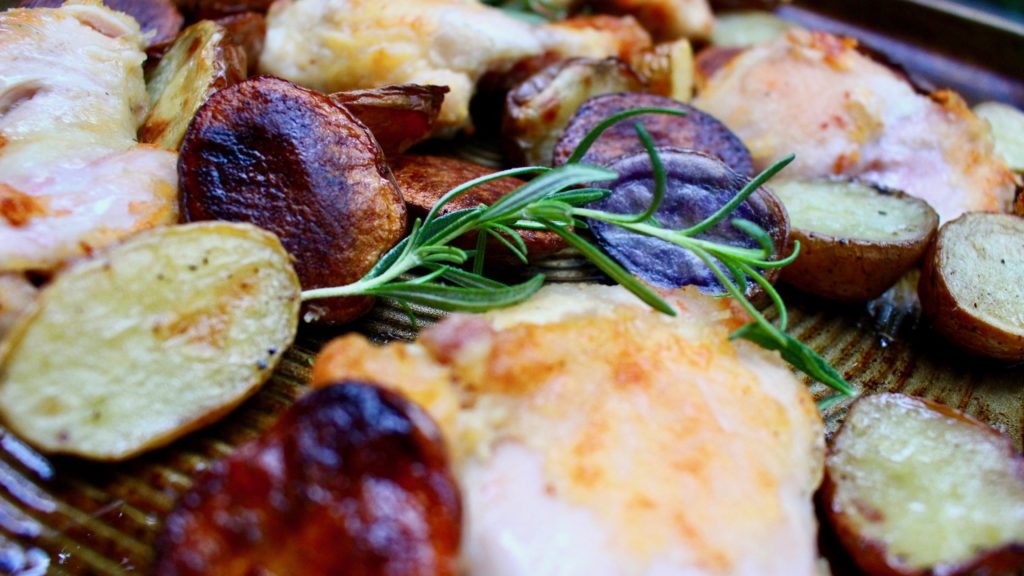 Chestnut brown crunchy chicken with crispy roasted potatoes