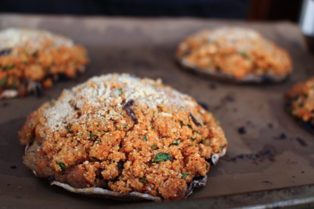 Sicilian stuffed mushrooms are mushroom caps filled with breadcrumbs, Pecorino cheese, parsley, Pine nuts and garlic, then baked until golden brown